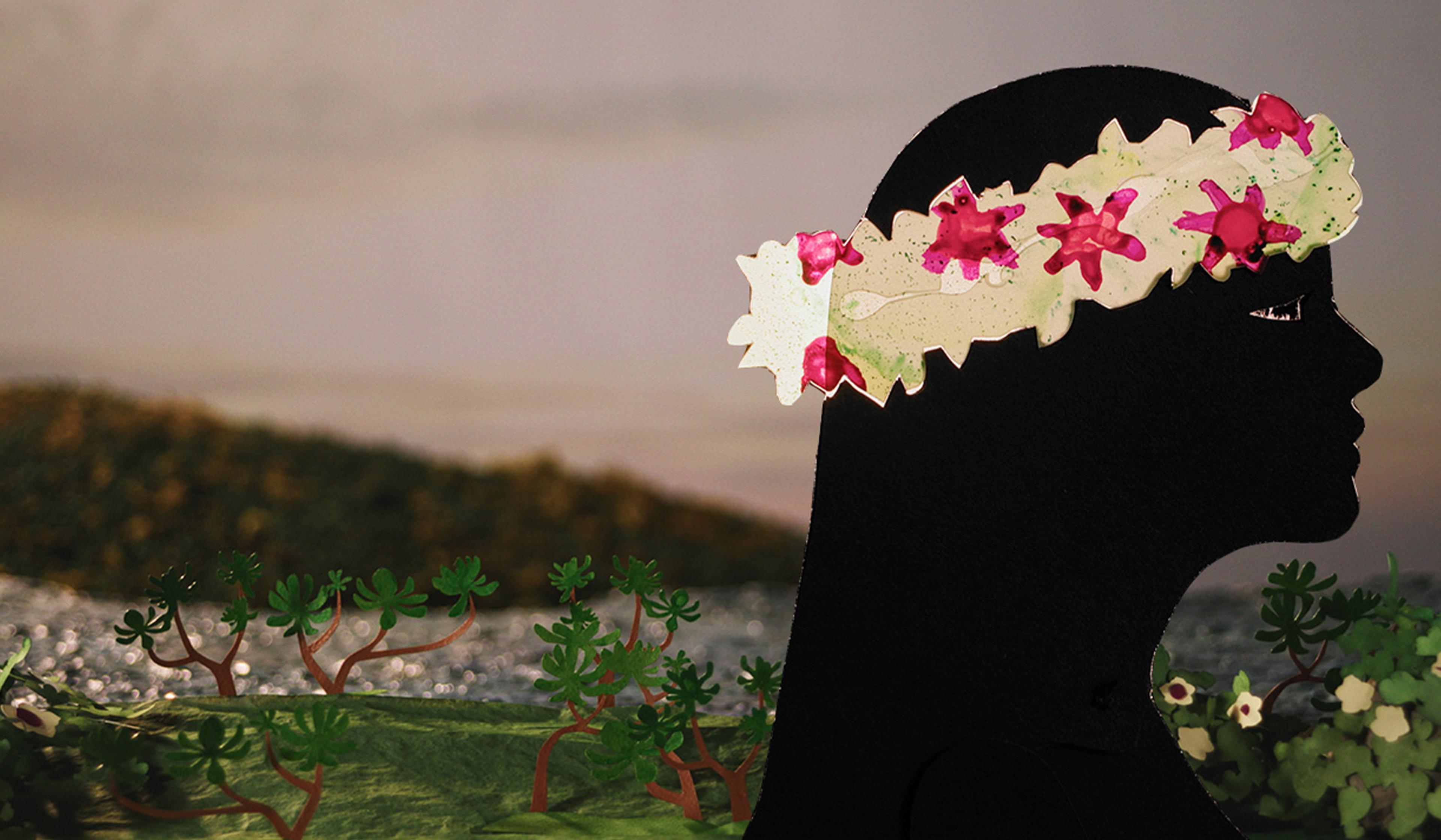 Artwork depicting a silhouette of a person wearing a floral headband, with a natural background of plants and blurred scenery.